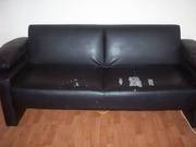 pair of black faux leather sofa beds
